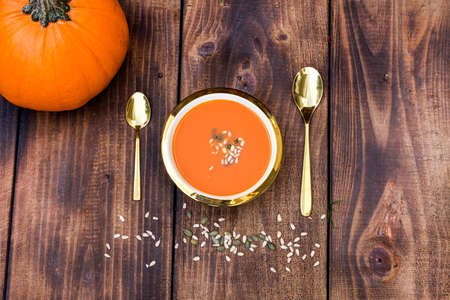 Vegetarian autumn pumpkin cream soup with seeds. Autumn food concept.の写真素材