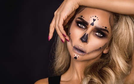 Sexy witch with Halloween skeleton make up - Imageの写真素材