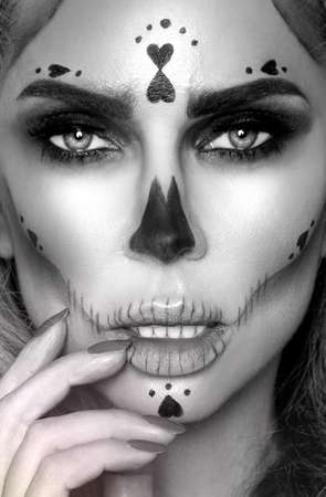 Halloween Sexy Witch portrait. Beautiful young woman in witches makeup with long curly colorful hair...