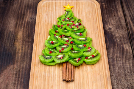 Christmas Tree made of food on wooden background. Top view. Flat lay. Christmas and New Year Holidays conceptの写真素材