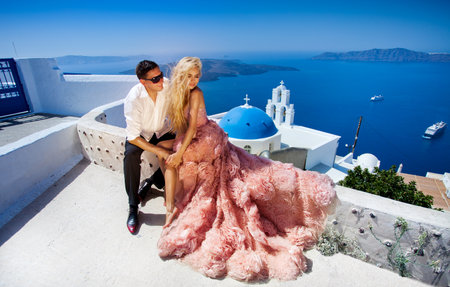 beautiful bride and groom in their summer wedding day on greek island Santoriniの写真素材
