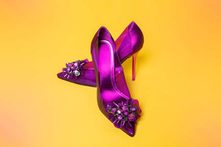 Bright colored women's shoes on a pastel background. Copy space text. High heels. Shoes fashion.の写真素材