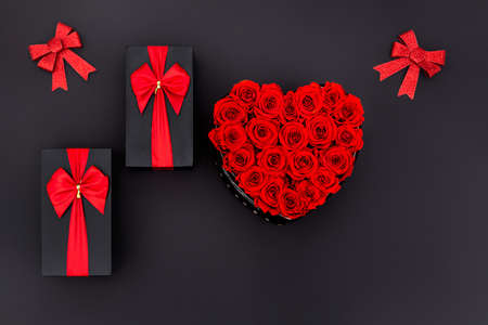 Valentines Day Heart Made of Red Roses Isolated on black Background.