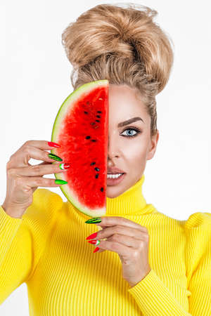 Beautiful girl showing summer manicure nails. makeup and cosmetics. Trendy Watermelon Summer Manicure. Beauty Fashion Makeup and Manicure. Glamor Nail Art and Make up closeup over white background.の写真素材