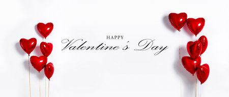 Set of Air Balloons. Bunch of red color heart shaped foil balloons isolated on white background....