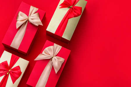 Valentine's day. Red background with Valentines gifts decor. Top view with copy space. Minimalism....