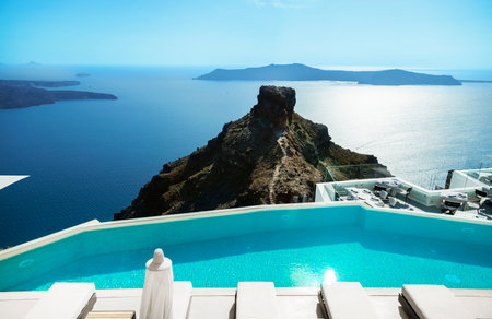 Santorini, Greece. Amazing view of blue sky, sea and Skaros rock from luxury resrot in Imerovigli in Santorini greek island. Location: Imerovigli Santorini, Greece.の写真素材