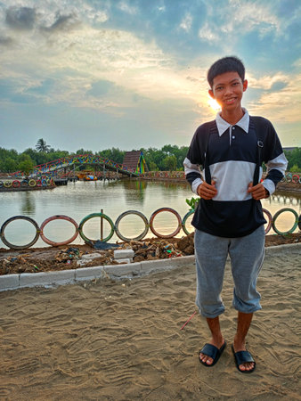 A boy on a mangrove beach in the afternoonの写真素材