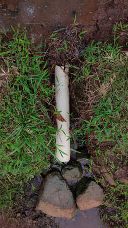 PHOTOS OF FARMER'S SIMPLE WATER DISPOSAL, DAY TIME . made using simple materials using bamboo. some use a pipe.の写真素材
