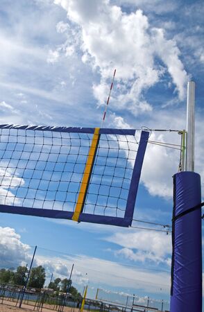 Rows of beach volleyball net over blue cloudy skyの写真素材