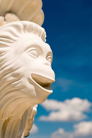 Monkey face over cloudy sky at Oranienbaum, Russiaの写真素材