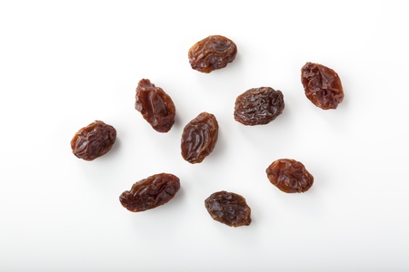 dried grapes isolated on whiteの写真素材