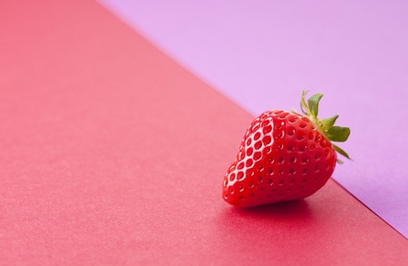 Strawberry was placed on top of the background of purpleの写真素材