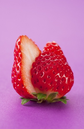 Strawberry was placed on top of the background of purpleの写真素材
