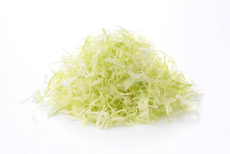 Shredded cabbage placed on a white backgroundの写真素材