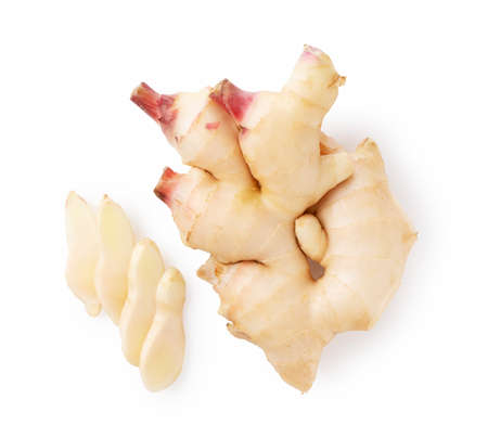 Fresh ginger and sliced fresh ginger on a white backgroundの写真素材