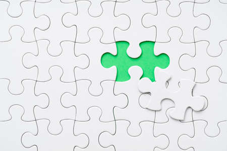 White Jigsaw Puzzle with Green Background