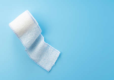 Bandages on a blue background.の写真素材