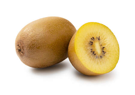 A cut golden kiwi on a white backgroundの写真素材