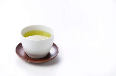 Green tea placed on a white background with space. Image of Japanese green teaの写真素材