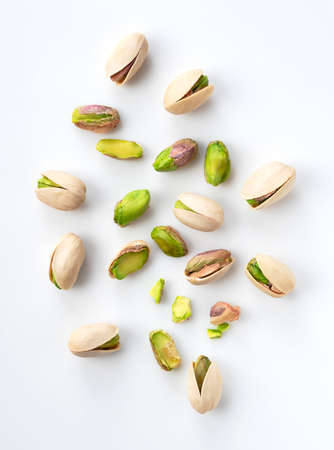 A bird's-eye view of pistachios on a white backgroundの写真素材