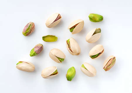 A bird's-eye view of pistachios on a white backgroundの写真素材