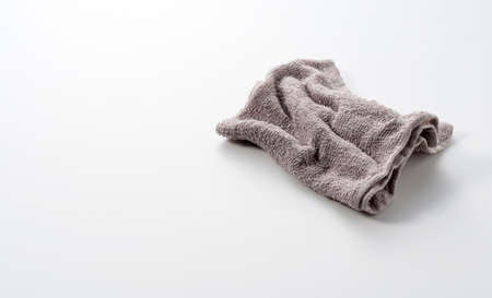 A grey rag placed on a white background with spaceの写真素材