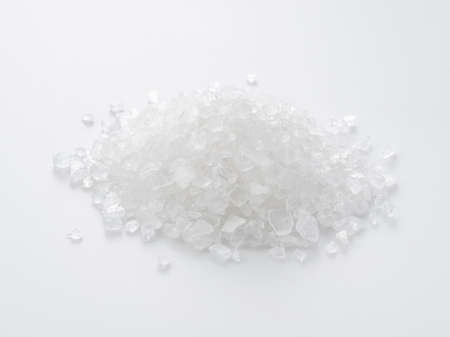 Close-up of Himalayan rock salt placed on a white background