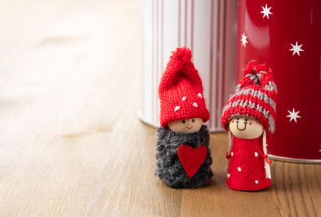 Boy and girl dolls on a wooden background. Christmas image. Valentine's Day image.の写真素材