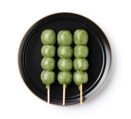 Kusadango dumplings placed on a white background. Japanese dumplings