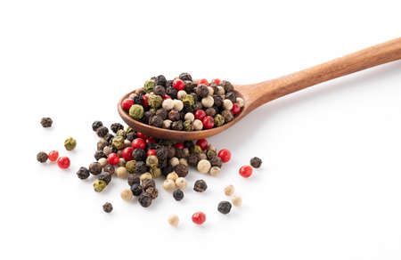 Pepper mix in a wooden spoon. Black, red, white, and green peppercorns on a white background....