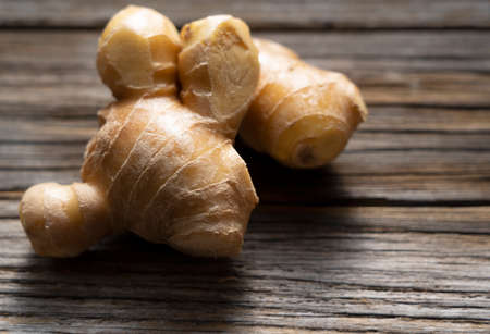 Ginger on an old wooden background with a copy space.の写真素材