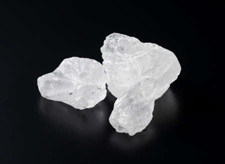 Uneven rock candy on a black background.