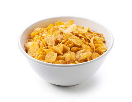 Cornflakes in a white ceramic bowl set against a white background.