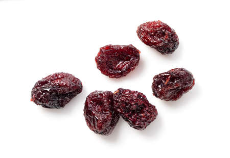Sweet dried cranberries on a white background. View from directly above.