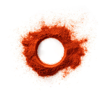 A round frame made of red pepper powder on a white background. View from above.の写真素材