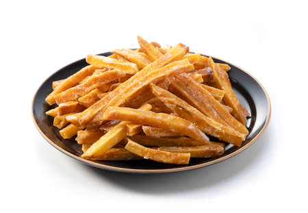 Imokempi placed on a white background. Imokempi is a Japanese sweet made from sweet potatoes that are fried and coated with sugar.の写真素材