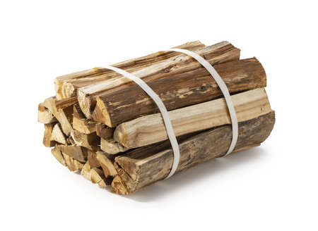 Firewood in bundles placed on a white background