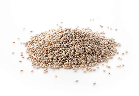 White chia seeds placed on a white background. Pile of them, close up.の写真素材