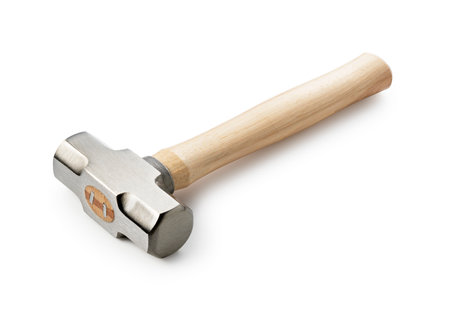 A hammer placed against a white background. Wooden handle.の写真素材