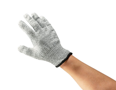 Male hand wearing knife-proof gloves on white background.の写真素材
