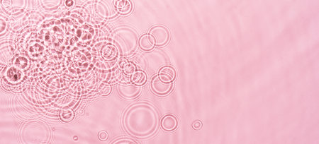Water ripples on pink background. Abstract water ripples texture.の写真素材