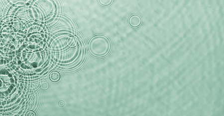 Water ripples on green background. Abstract water ripples texture.の写真素材