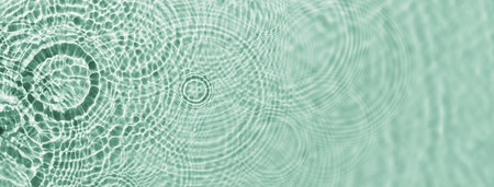 Water ripples on green background. Abstract water ripples texture.の写真素材
