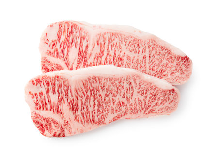 Fresh raw beef steaks set against a white background. Wagyu beef steak.の写真素材