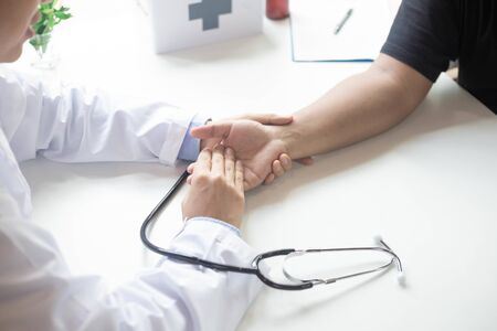 Doctor comforting patientの写真素材