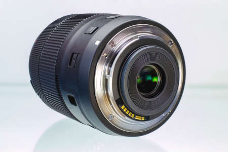 Camera or photo camera lens on a white background. Close-up. Macro shootingの写真素材