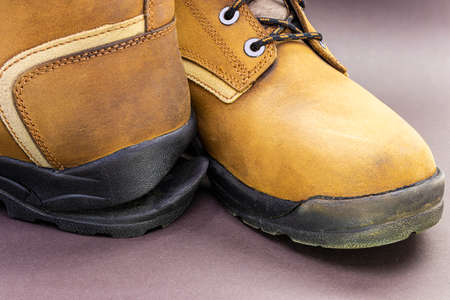Torn men's leather shoes. Torn shoe sole. Shoe repair. Close-upの写真素材