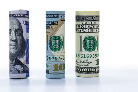 One hundred dollar banknote rolled into a tube. Close-up. Isolated white background. Concept for design.の写真素材