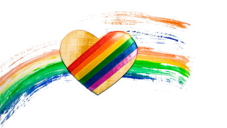 Heart with LGBT symbols on a rainbow background. Concept LGBT for design. Gay pride rainbow LGBT flag design background. Symbol of LGBT movement. Valentine's Day.の写真素材